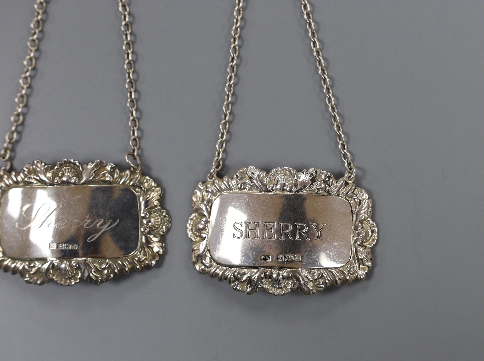 A modern pair of silver 'Sherry' & 'Madeira' wine labels, three other silver 'Sherry' wine labels and a plated wine label.